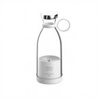 Clear glass carafe with white lid on a white background