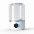 Clear cylindrical humidifier with a dark circular button on a white background