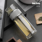 Clear glass bottle with metal cap on a dark surface