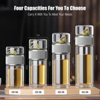 Set of four clear glass bottles with metal caps, labeled for different capacities on a wooden stand.
