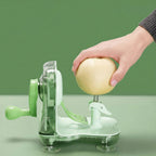 Person using a green apple peeler on a light green background
